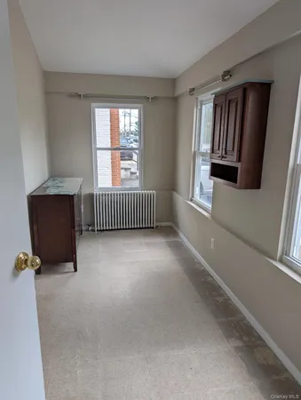 a view of an empty room with glass door