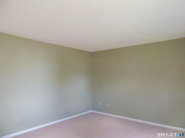 a view of a hallway with a window