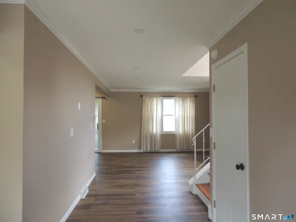 a view of entryway with wooden floor