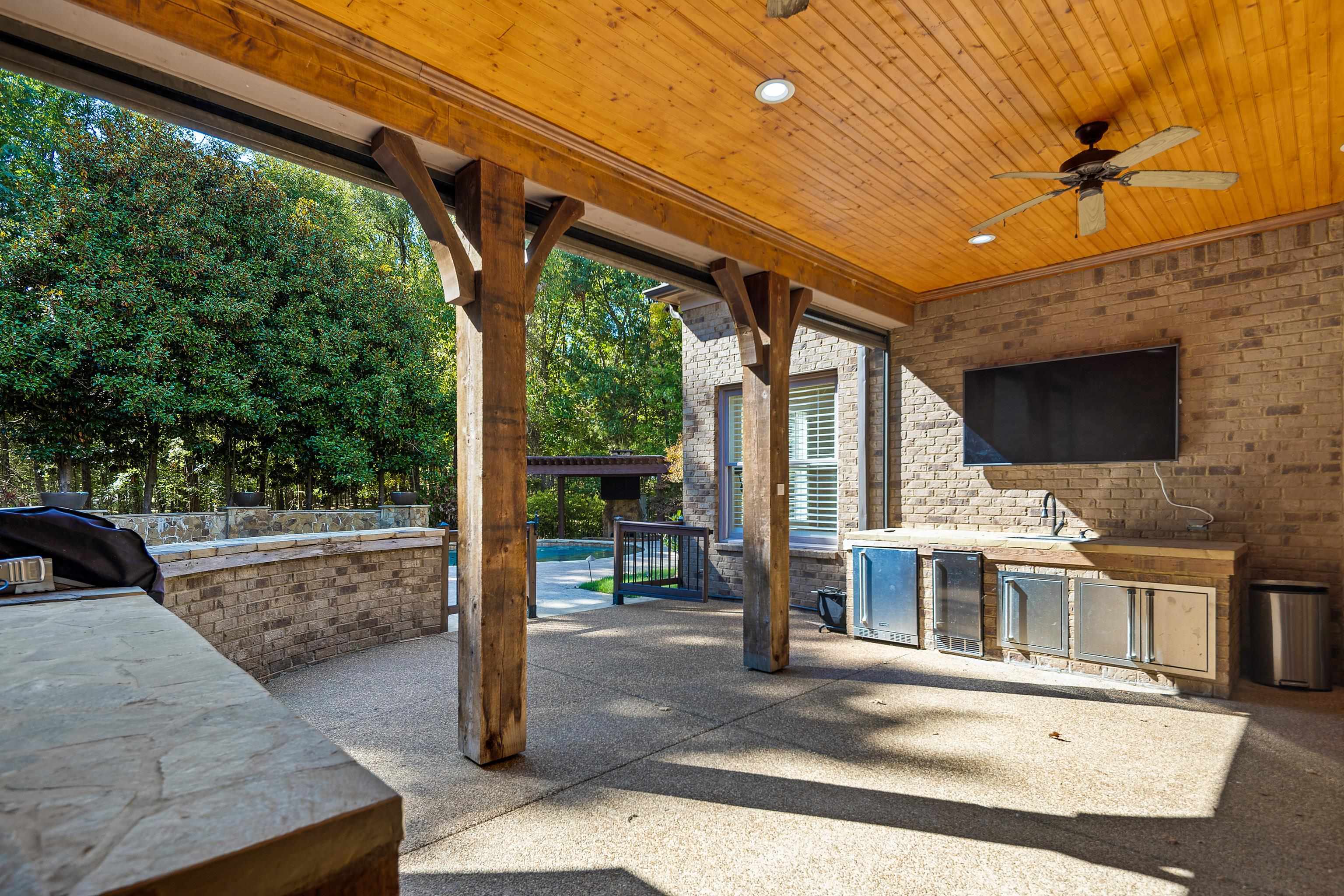 425 Buckland Cove Eads, TN 38028 - Photo 23 of 29 View of patio with area for grilling, a ceiling fan, and beverage cooler