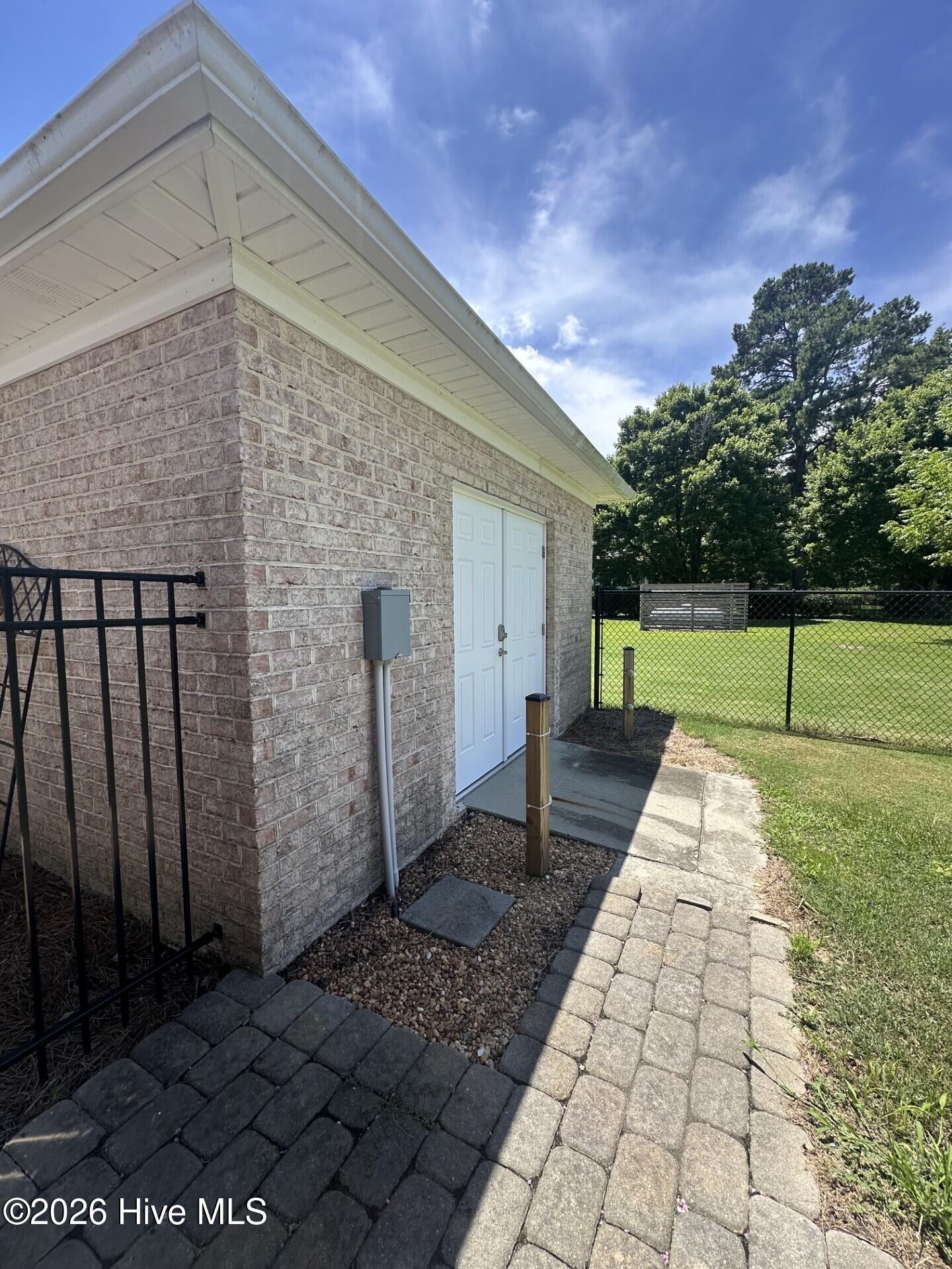 1380 Bear Trap Road Williamston, NC 27892 - Photo 37 of 49 Outside of wired brick workshop/storage