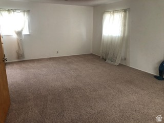 1615 Pioneer Road Draper, UT 84020 - Photo 11 of 13 Spacious room featuring neutral carpeting and white wall finishes