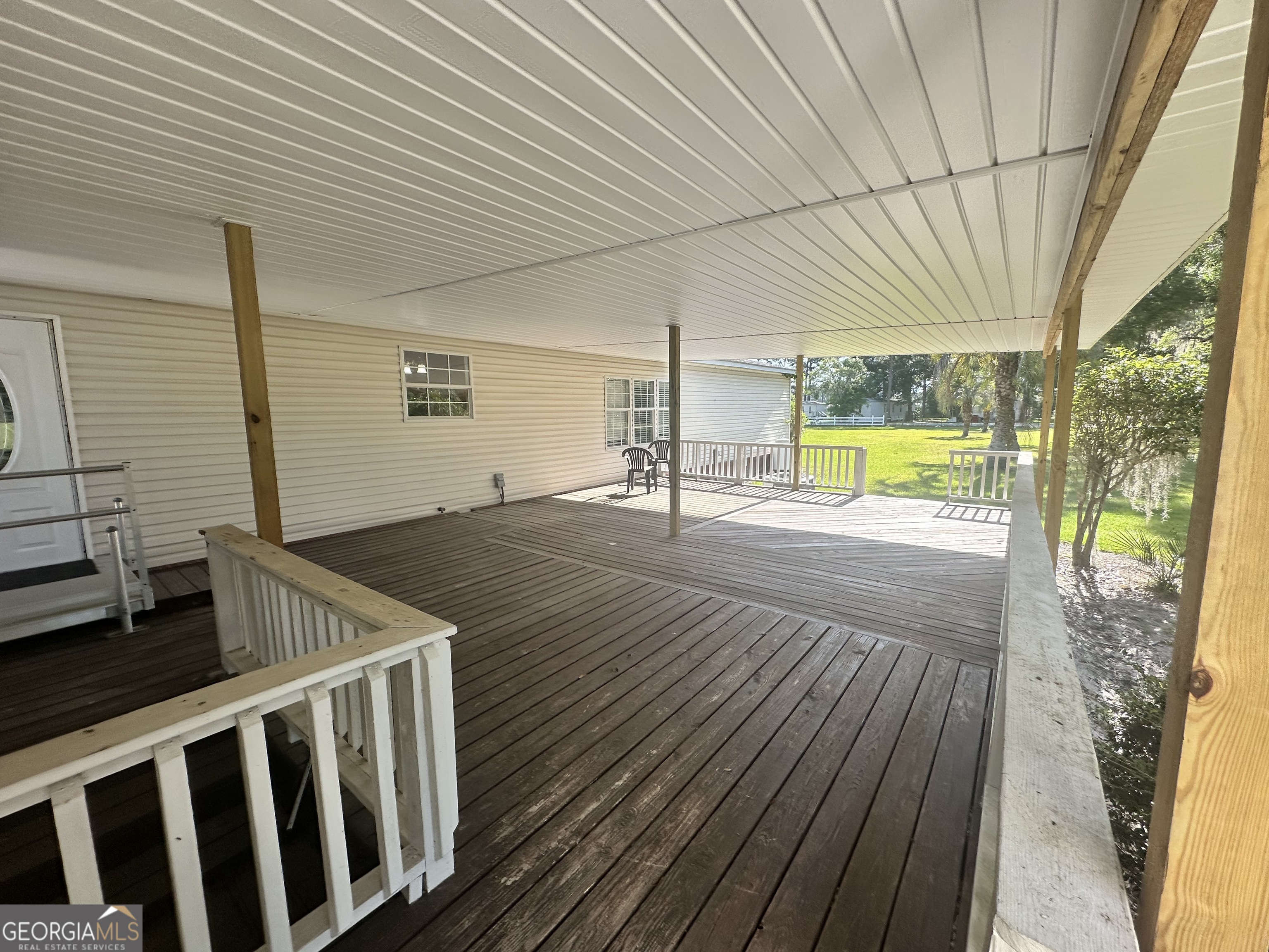 6498 Central Avenue Waycross, GA 31503 - Photo 14 of 20 a view of a patio with wooden floor