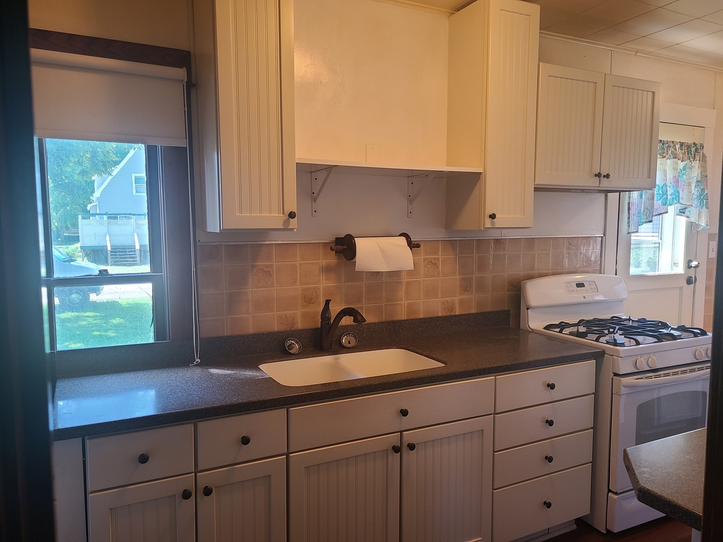 537 2nd Avenue Ottawa, IL 61350 - Photo 5 of 27 a kitchen with cabinets appliances a sink and a window