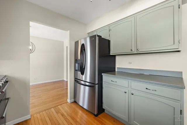 a kitchen with appliances and cabinets