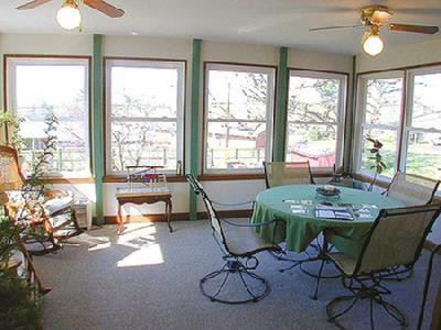 660 Kingston Road Lexington, KY 40505 - Photo 6 of 9 This sunroom is a haven for the person w