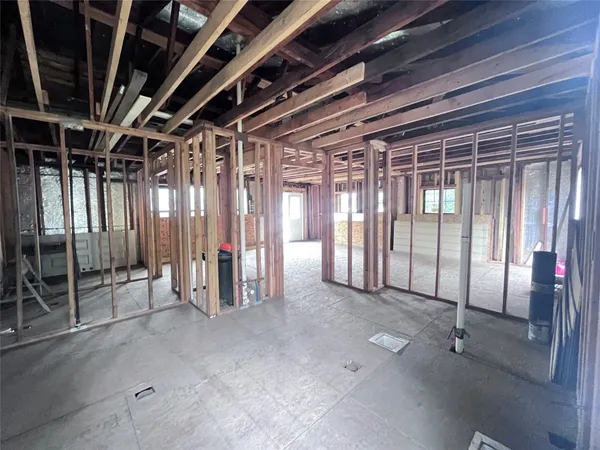 a view of an empty room with glass door