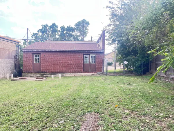 a brick house with a yard