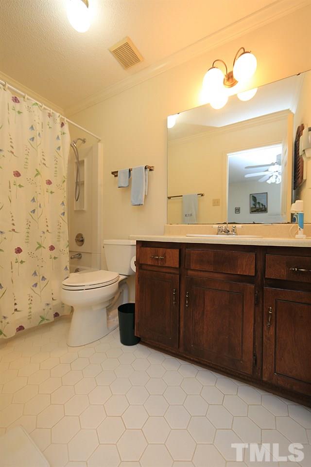 1506 Edgeside Court Raleigh, NC 27609 - Photo 17 of 23 Ensuite full bath for the back bedroom upstairs.