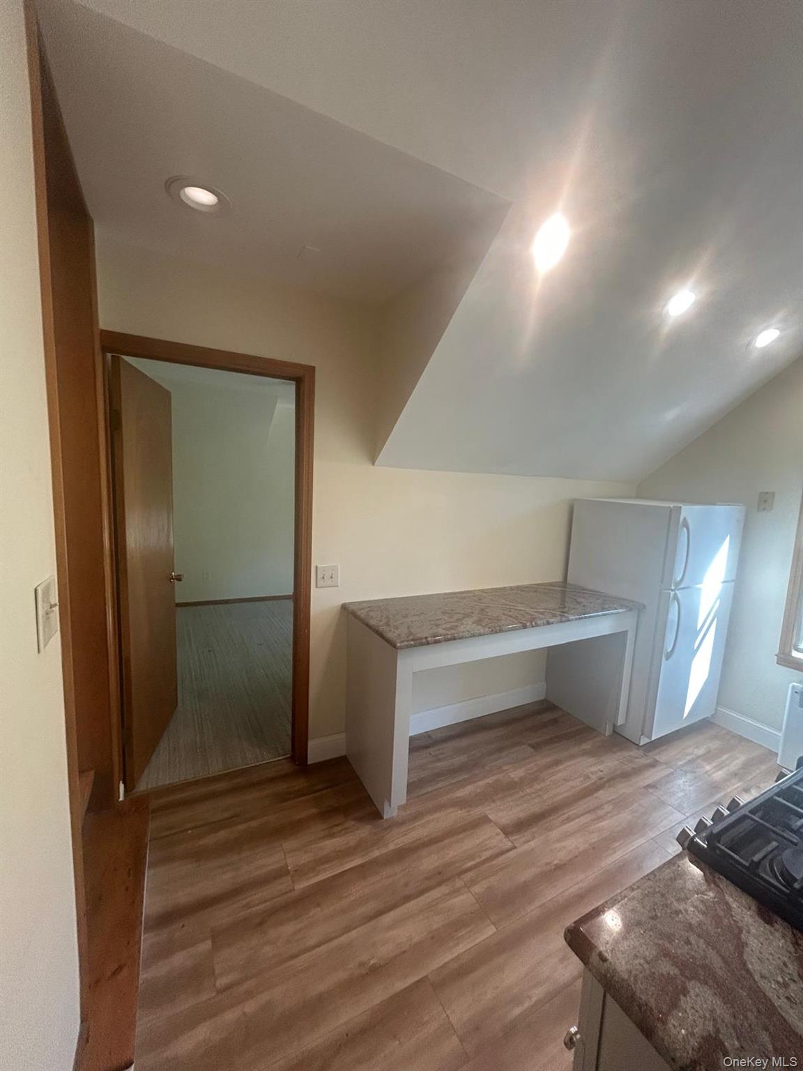 42 Park Avenue, Unit 3 Suffern, NY 10901 - Photo 8 of 13 a room with stairs and a wooden floor