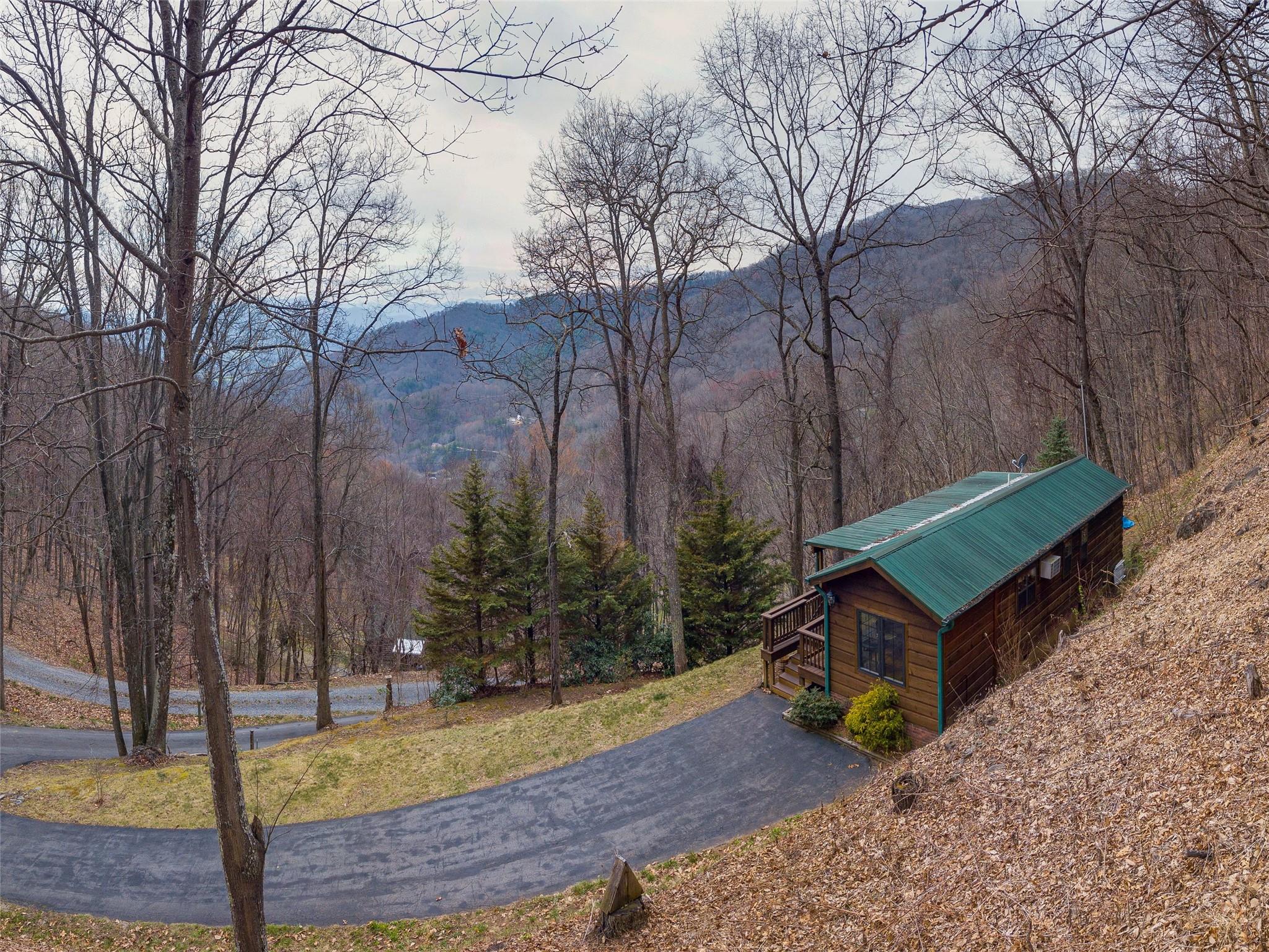 239 Sugar Hill Road Clyde, NC 28721 - Photo 1 of 20 a view of a backyard with swimming pool