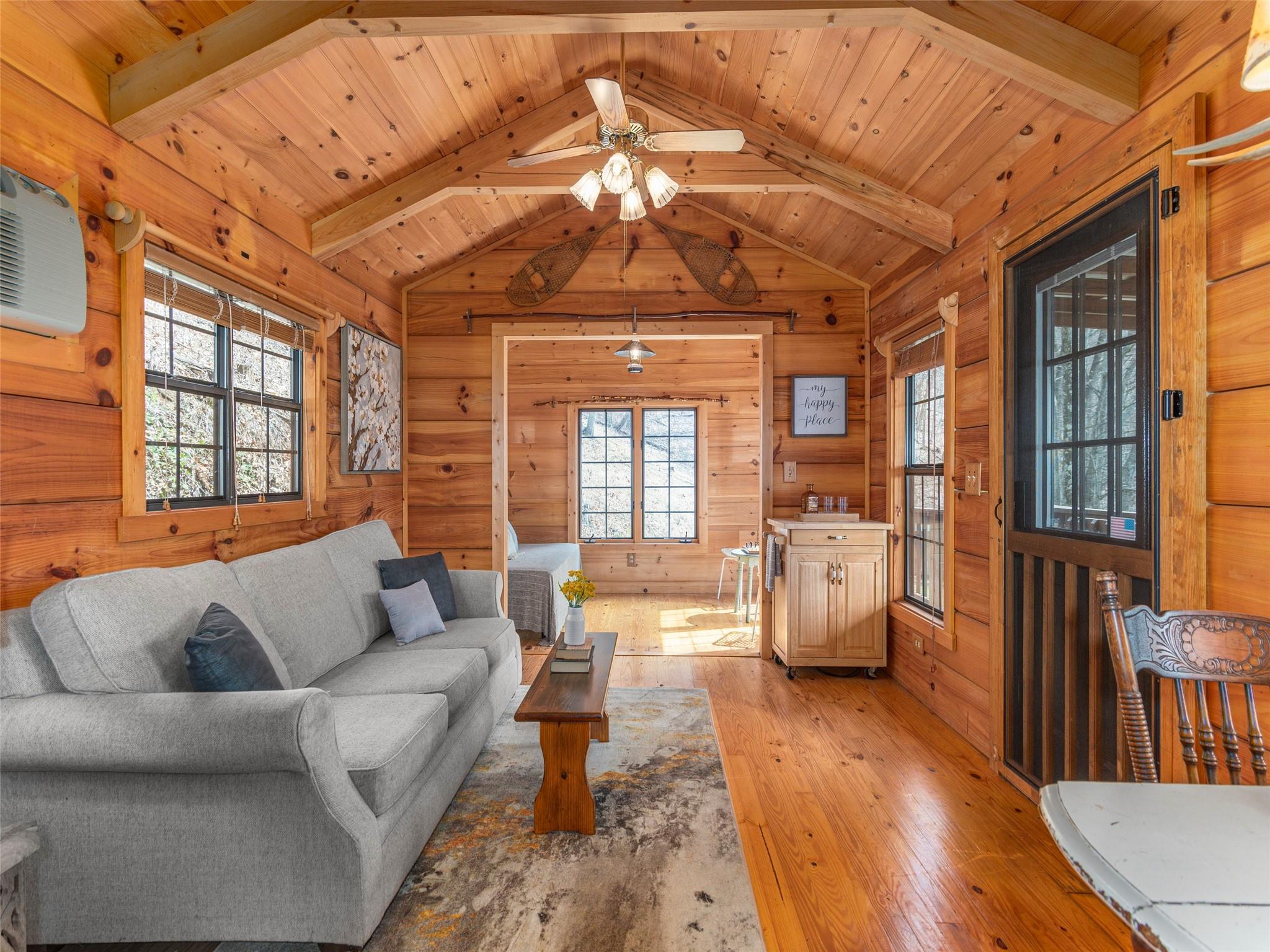 239 Sugar Hill Road Clyde, NC 28721 - Photo 5 of 20 a living room with furniture and a large window