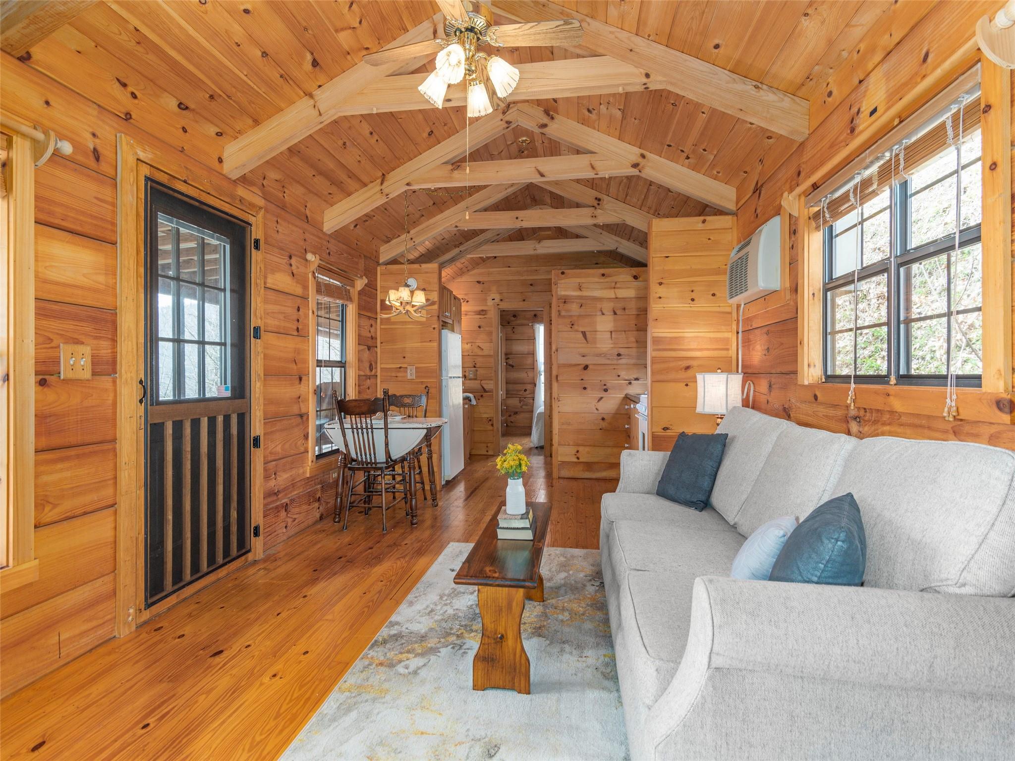 239 Sugar Hill Road Clyde, NC 28721 - Photo 6 of 20 a living room with furniture and a table
