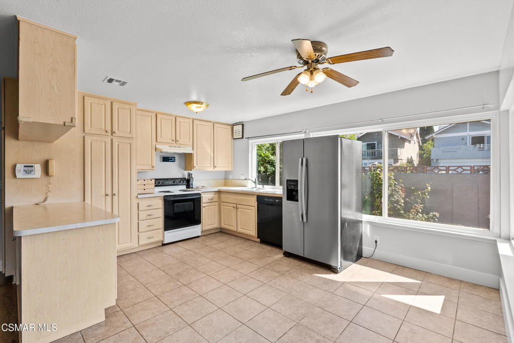 3998 Celia Court Simi Valley, CA 93063 - Photo 21 of 44 a kitchen with a refrigerator a sink and dishwasher