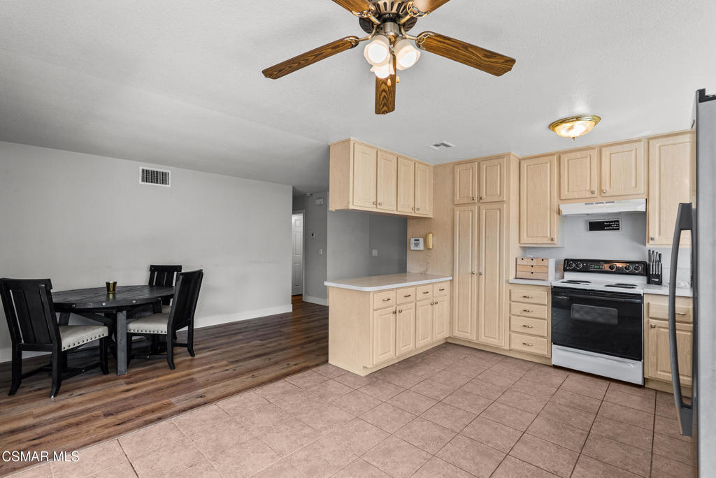3998 Celia Court Simi Valley, CA 93063 - Photo 22 of 44 a kitchen with stainless steel appliances a stove refrigerator sink and cabinets