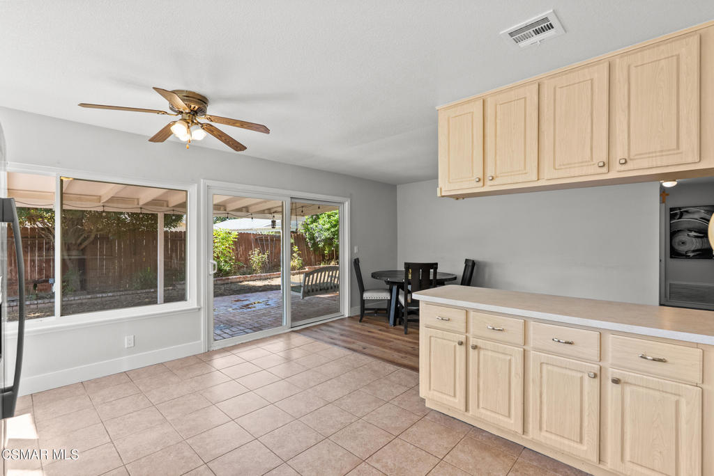 3998 Celia Court Simi Valley, CA 93063 - Photo 25 of 44 a kitchen with white cabinets and white appliances