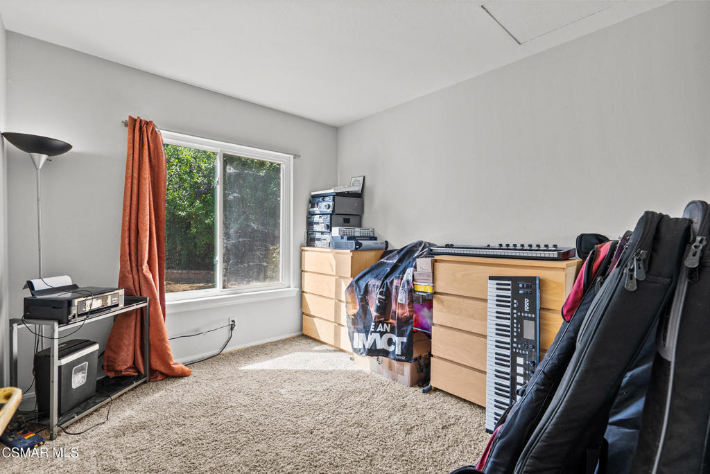 3998 Celia Court Simi Valley, CA 93063 - Photo 28 of 44 a view of a bedroom with furniture and a flat screen tv