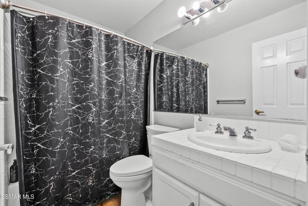 3998 Celia Court Simi Valley, CA 93063 - Photo 32 of 44 a bathroom with a sink toilet and shower