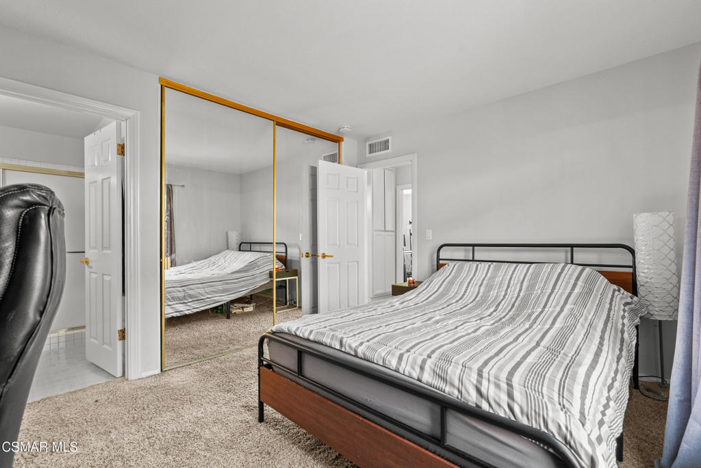 3998 Celia Court Simi Valley, CA 93063 - Photo 35 of 44 a bedroom with a bed and a mirror