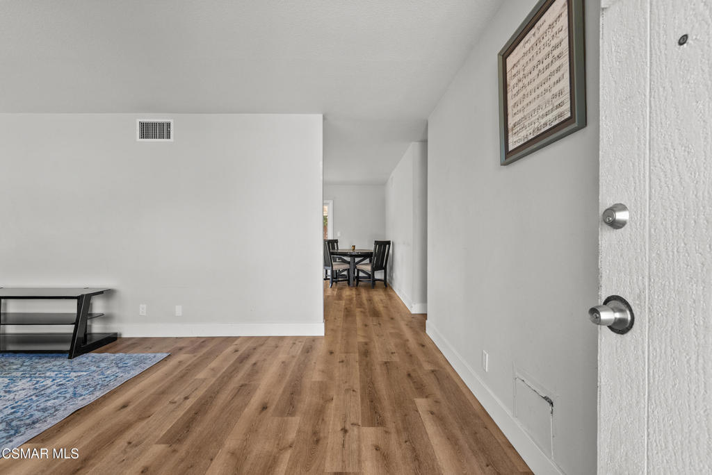 3998 Celia Court Simi Valley, CA 93063 - Photo 38 of 44 a view of a hallway with wooden floor and staircase