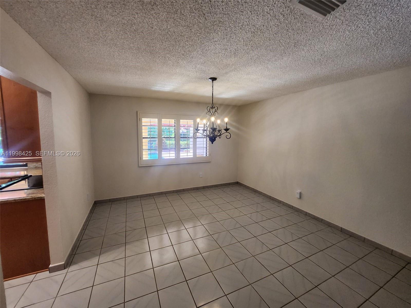 2980 Southwest 111th Avenue Miami, FL 33165 - Photo 11 of 39 an empty room with windows