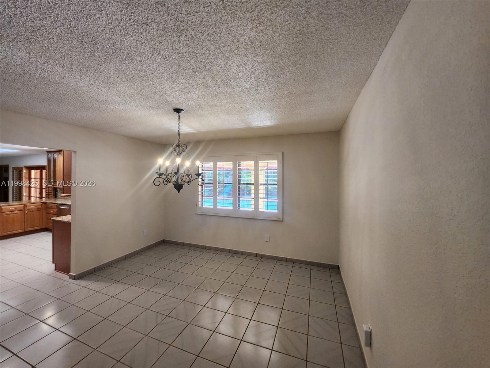 2980 Southwest 111th Avenue Miami, FL 33165 - Photo 12 of 39 wooden floor in an empty room with a window