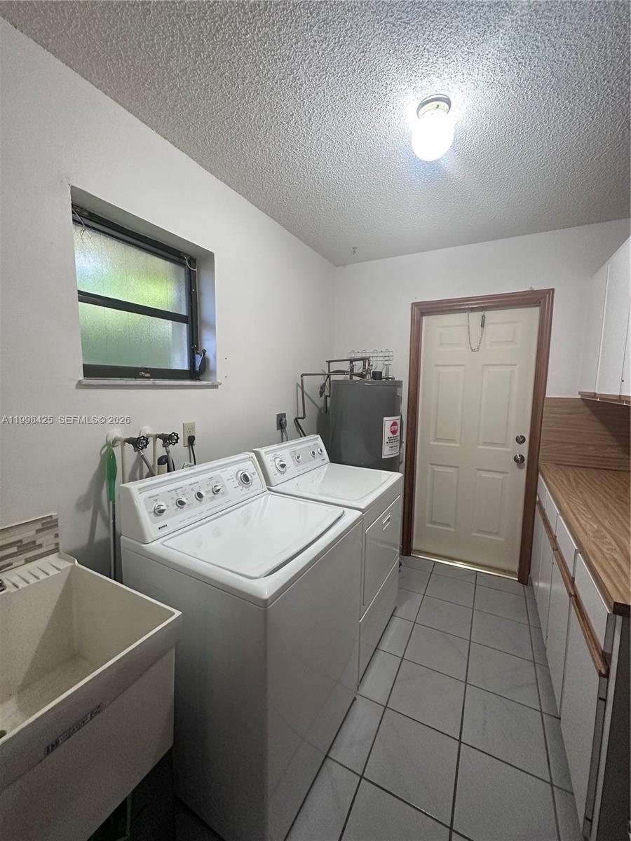 2980 Southwest 111th Avenue Miami, FL 33165 - Photo 15 of 39 a bathroom with a sink and a bathtub