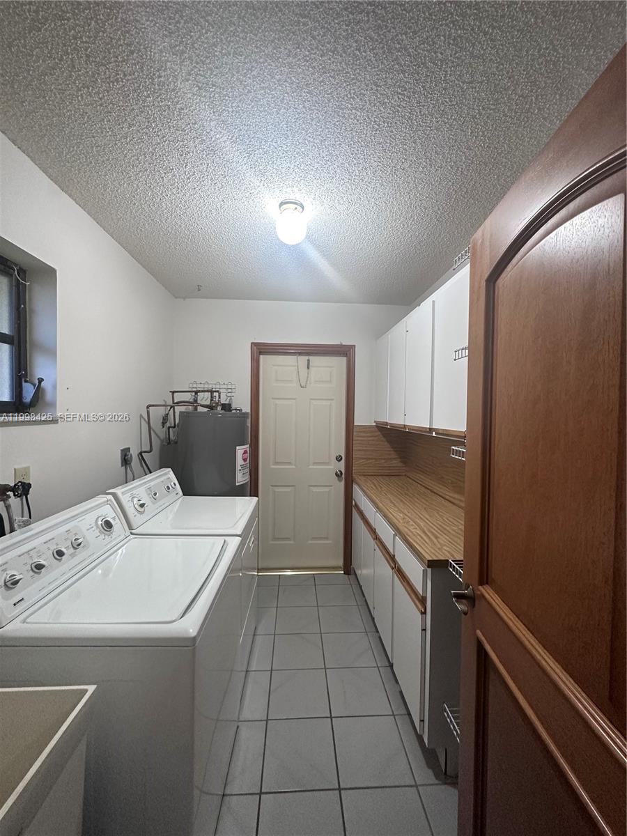 2980 Southwest 111th Avenue Miami, FL 33165 - Photo 16 of 39 a kitchen with a sink and refrigerator