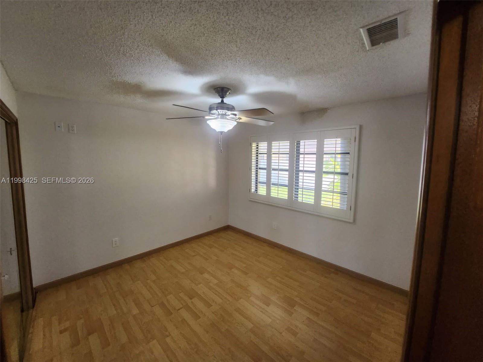 2980 Southwest 111th Avenue Miami, FL 33165 - Photo 17 of 39 a view of an empty room with a window