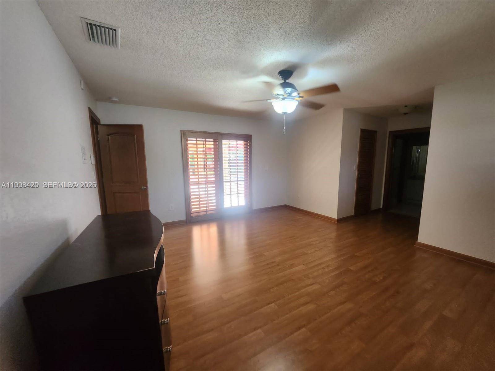 2980 Southwest 111th Avenue Miami, FL 33165 - Photo 23 of 39 wooden floor in an empty room with a window