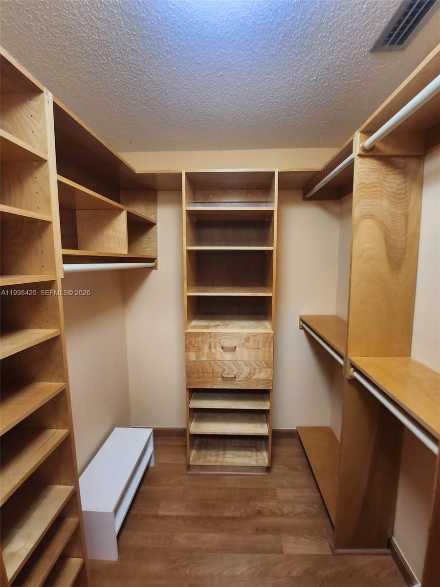 2980 Southwest 111th Avenue Miami, FL 33165 - Photo 24 of 39 a view of walk in closet with empty racks