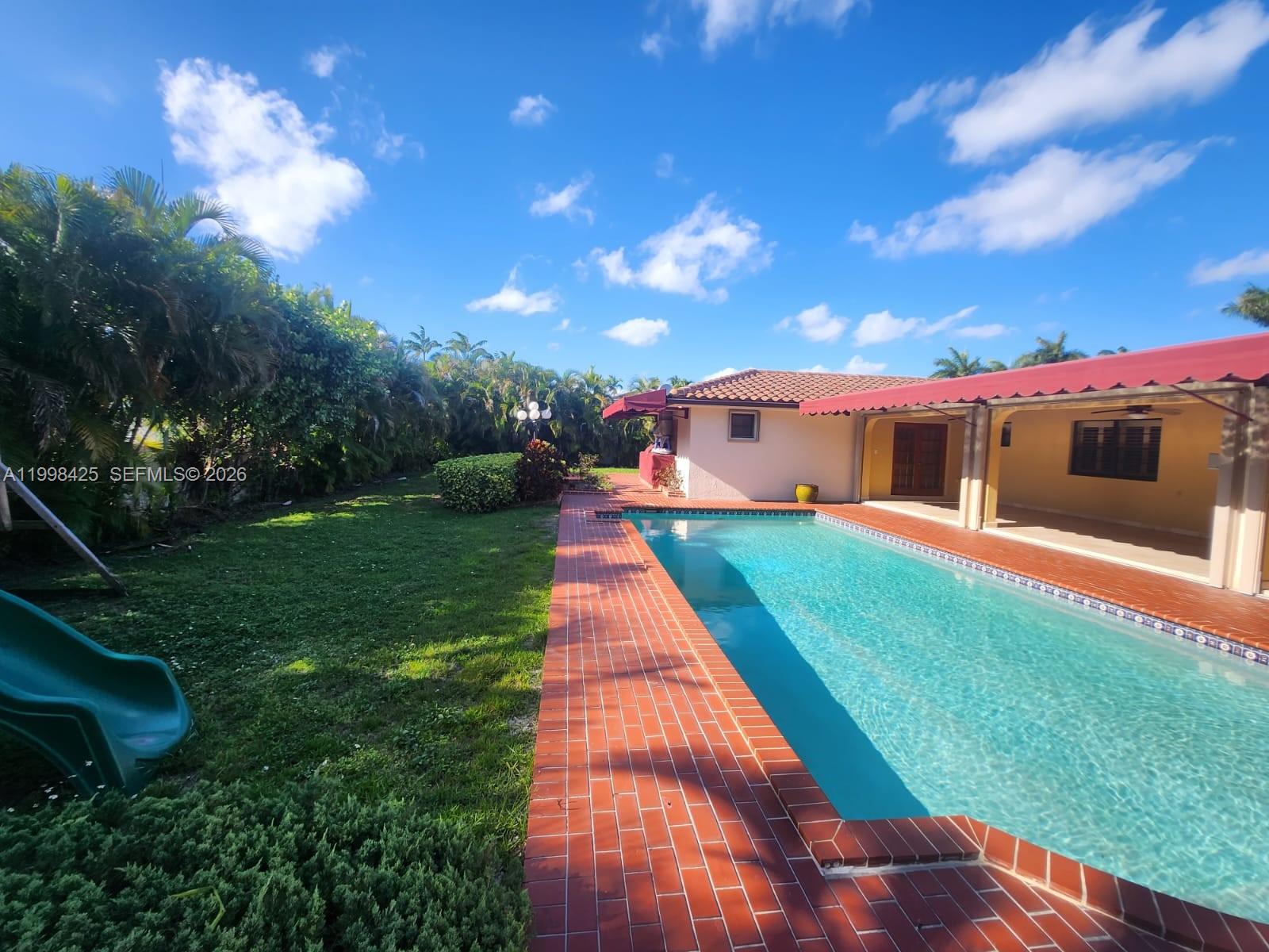 2980 Southwest 111th Avenue Miami, FL 33165 - Photo 34 of 39 a front view of house with yard and green space