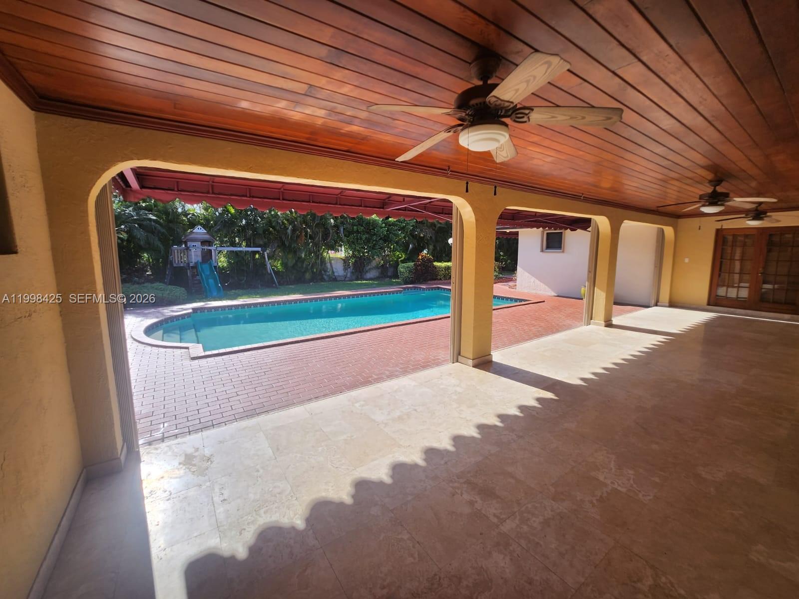 2980 Southwest 111th Avenue Miami, FL 33165 - Photo 36 of 39 a view of a room with porch and a patio