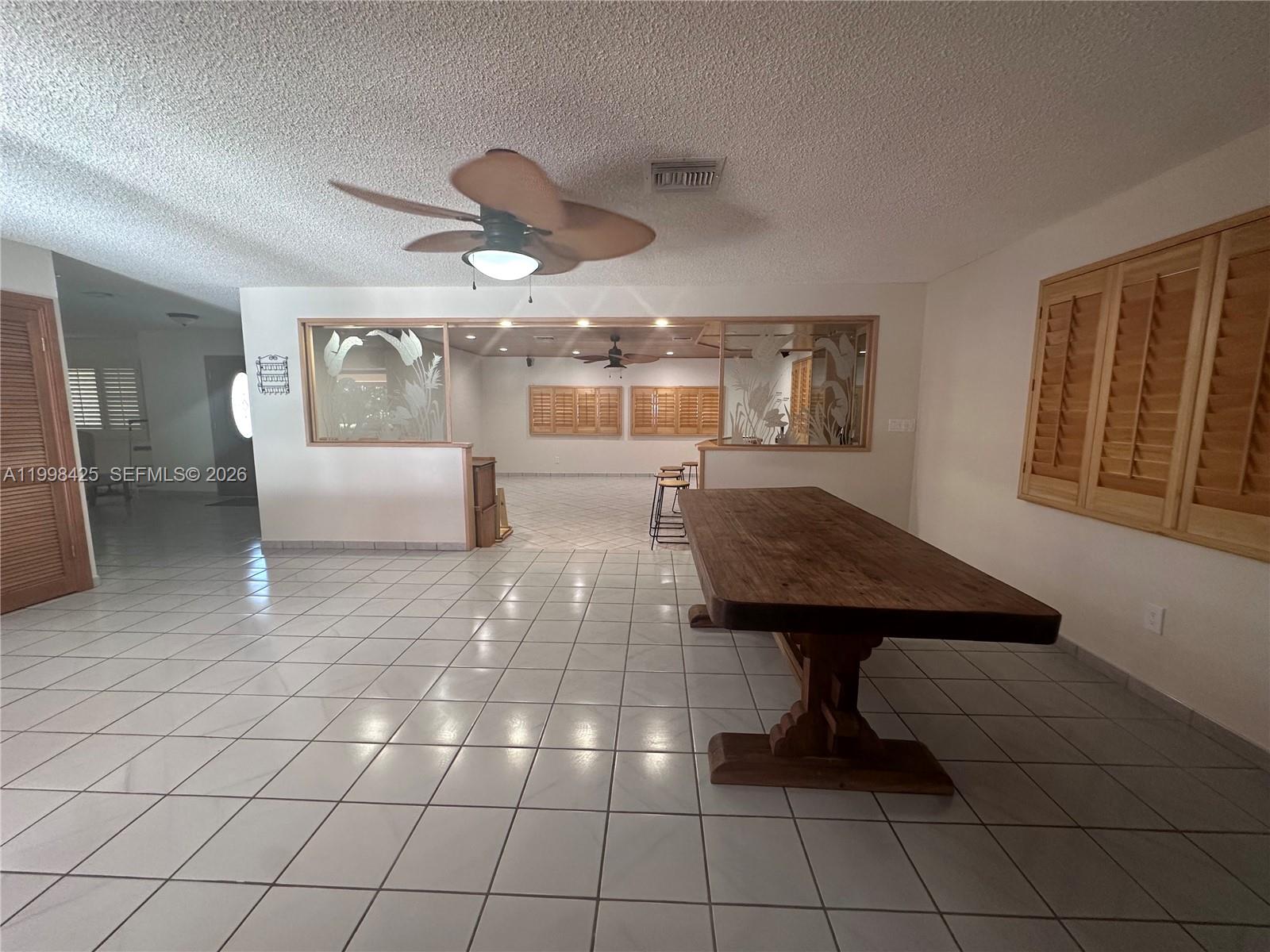 2980 Southwest 111th Avenue Miami, FL 33165 - Photo 7 of 39 a living room with furniture and a table