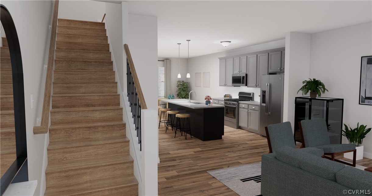 12208 Lightning Bug Loop Midlothian, VA 23112 - Photo 4 of 36 a room with stainless steel appliances kitchen island granite countertop a sink a counter space and cabinets