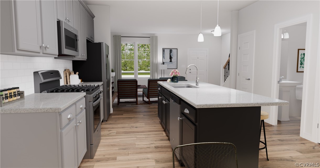 12208 Lightning Bug Loop Midlothian, VA 23112 - Photo 7 of 36 a kitchen with a sink stove and cabinets
