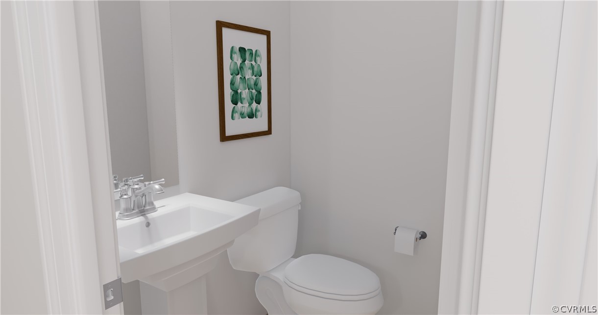 12208 Lightning Bug Loop Midlothian, VA 23112 - Photo 10 of 36 a white toilet sitting next to a bathroom sink