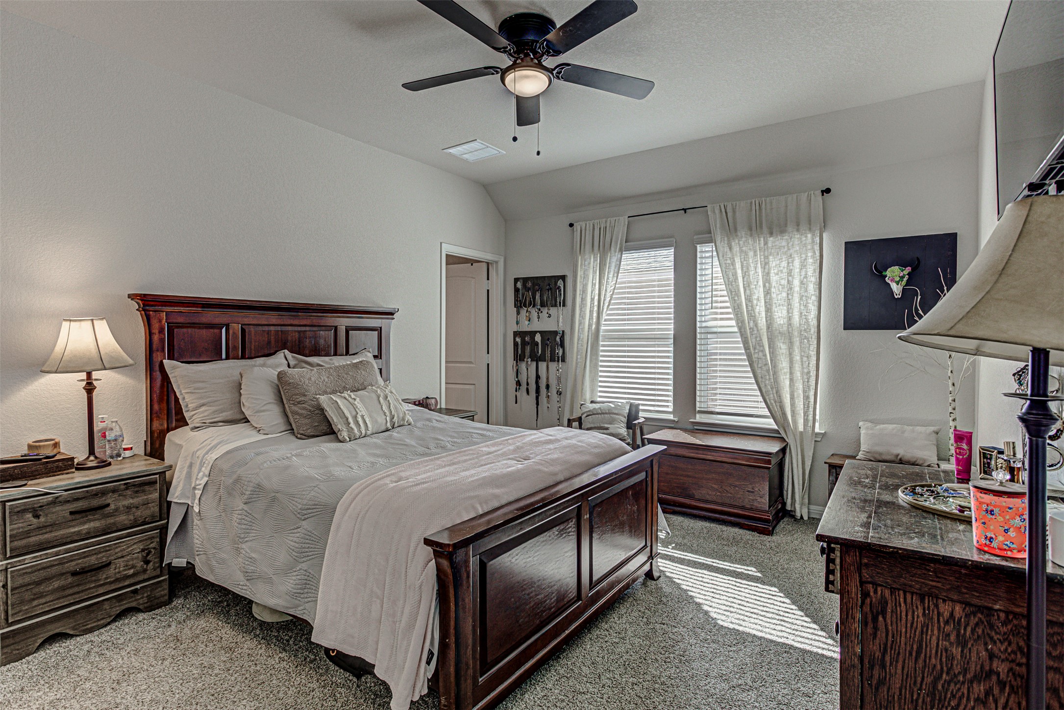309 Lone Cedar Road Marble Falls, TX 78654 - Photo 16 of 35 Carpeted bedroom with a ceiling fan and vaulted ceiling