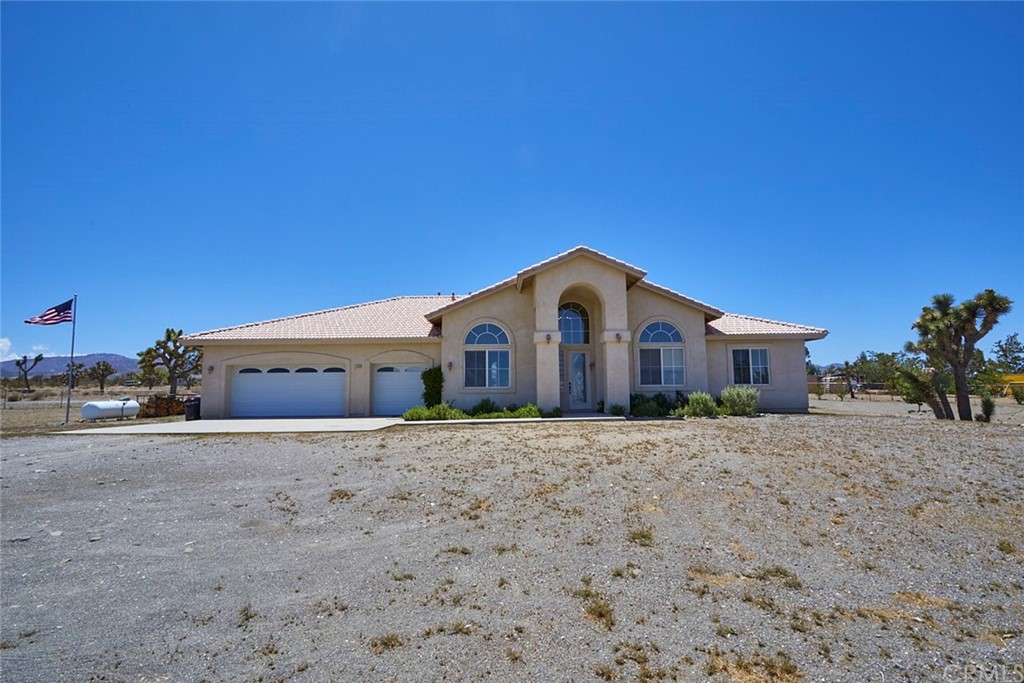 11430 Nugget Road Phelan, CA 92371 - Photo 1 of 1 a front view of a house with a yard