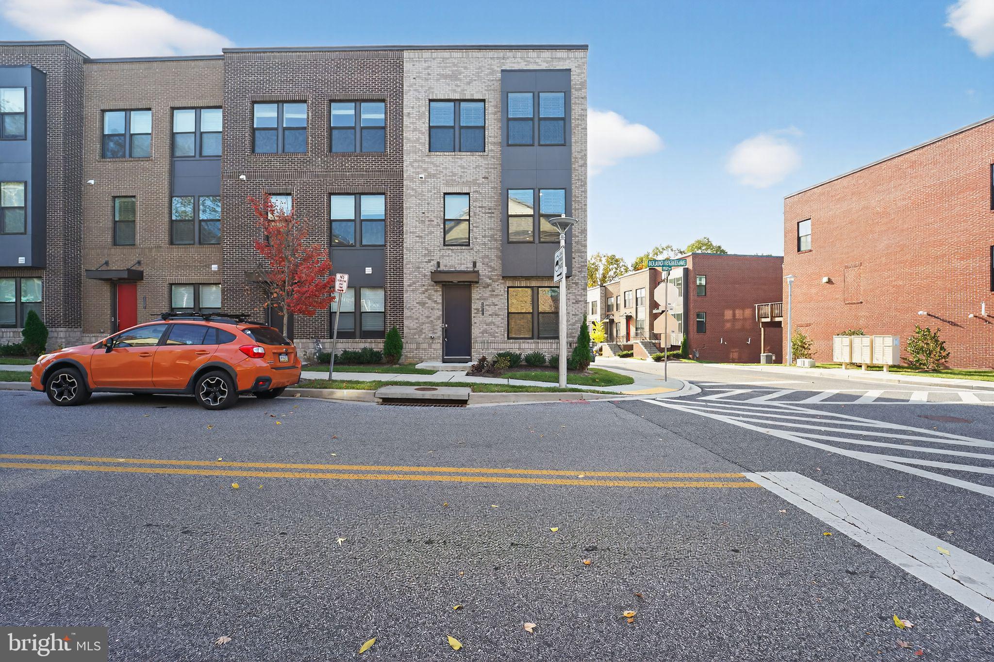 a couple of cars parked in front of a building