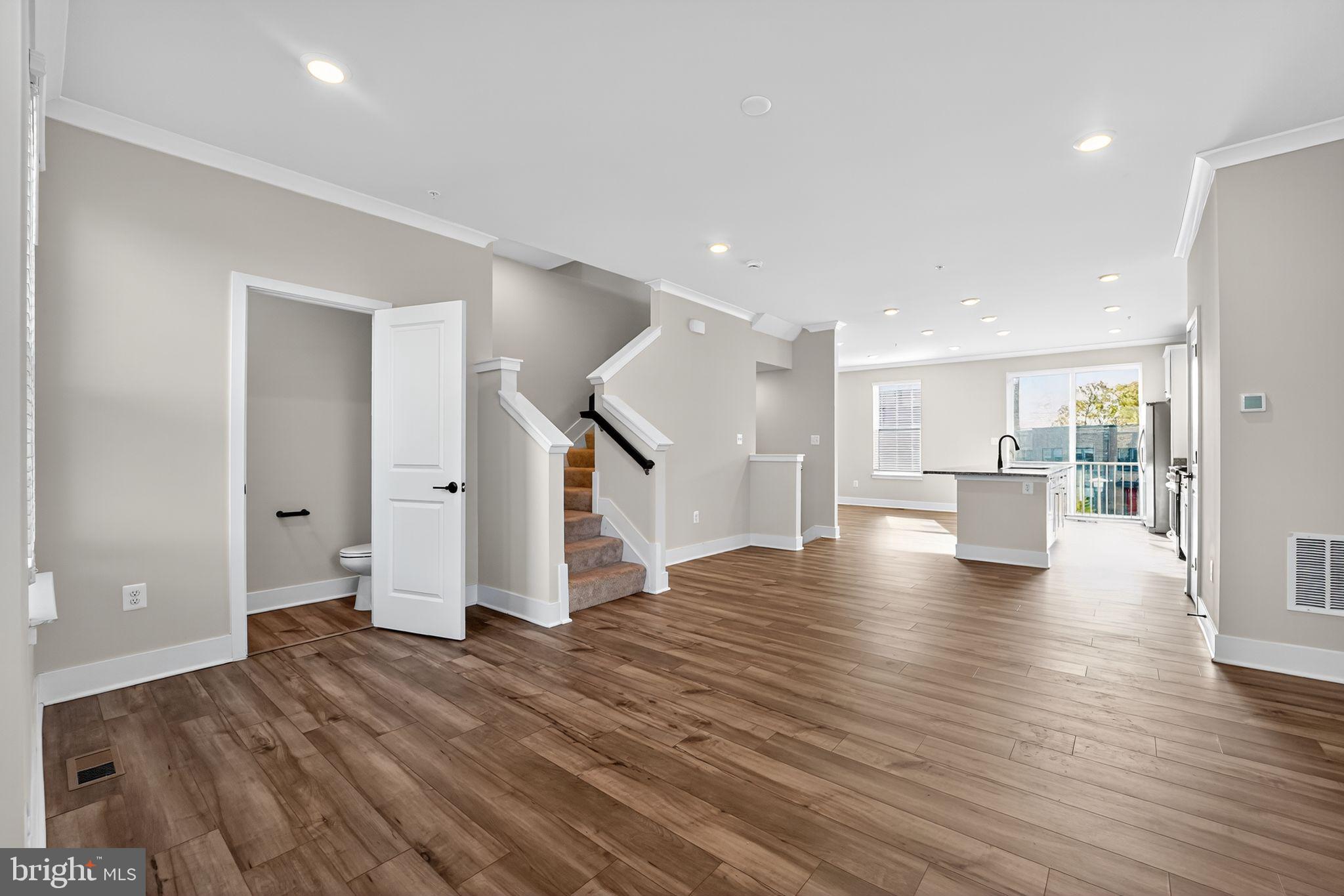 1511 Roland Heights Avenue Baltimore, MD 21211 - Photo 11 of 42 a view of a kitchen with wooden floor and a kitchen