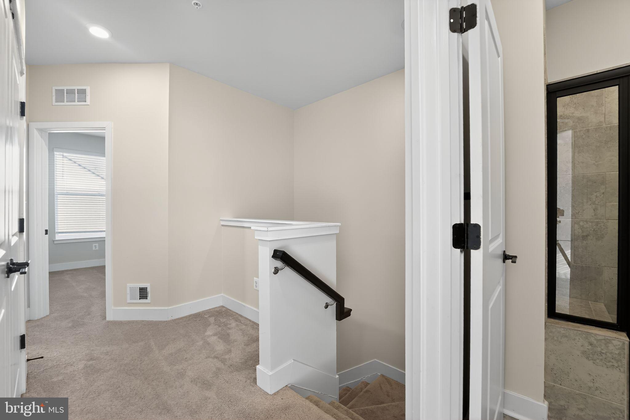 1511 Roland Heights Avenue Baltimore, MD 21211 - Photo 15 of 42 a view of an entryway with staircase