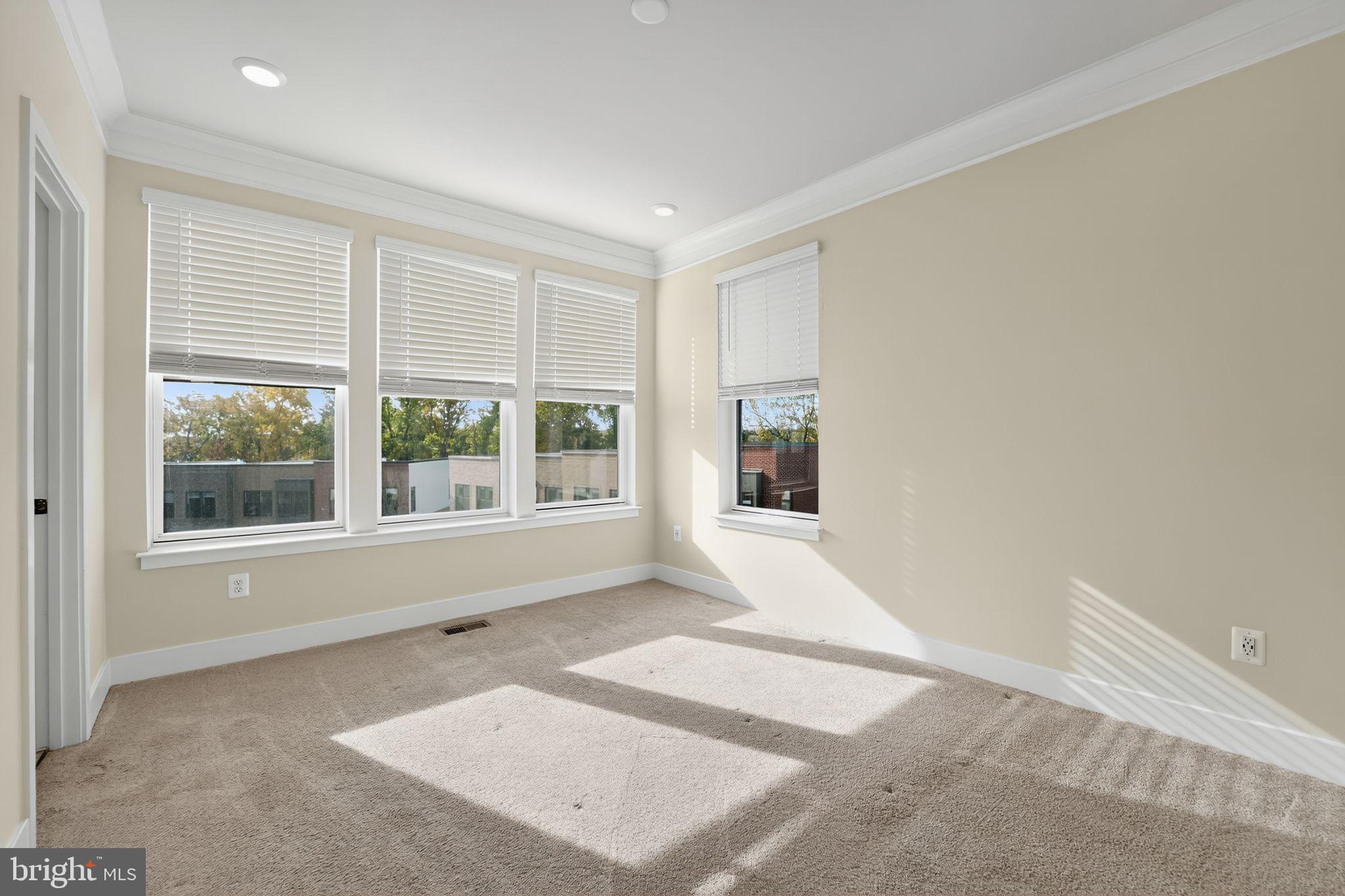 1511 Roland Heights Avenue Baltimore, MD 21211 - Photo 16 of 42 a view of an empty room with a window