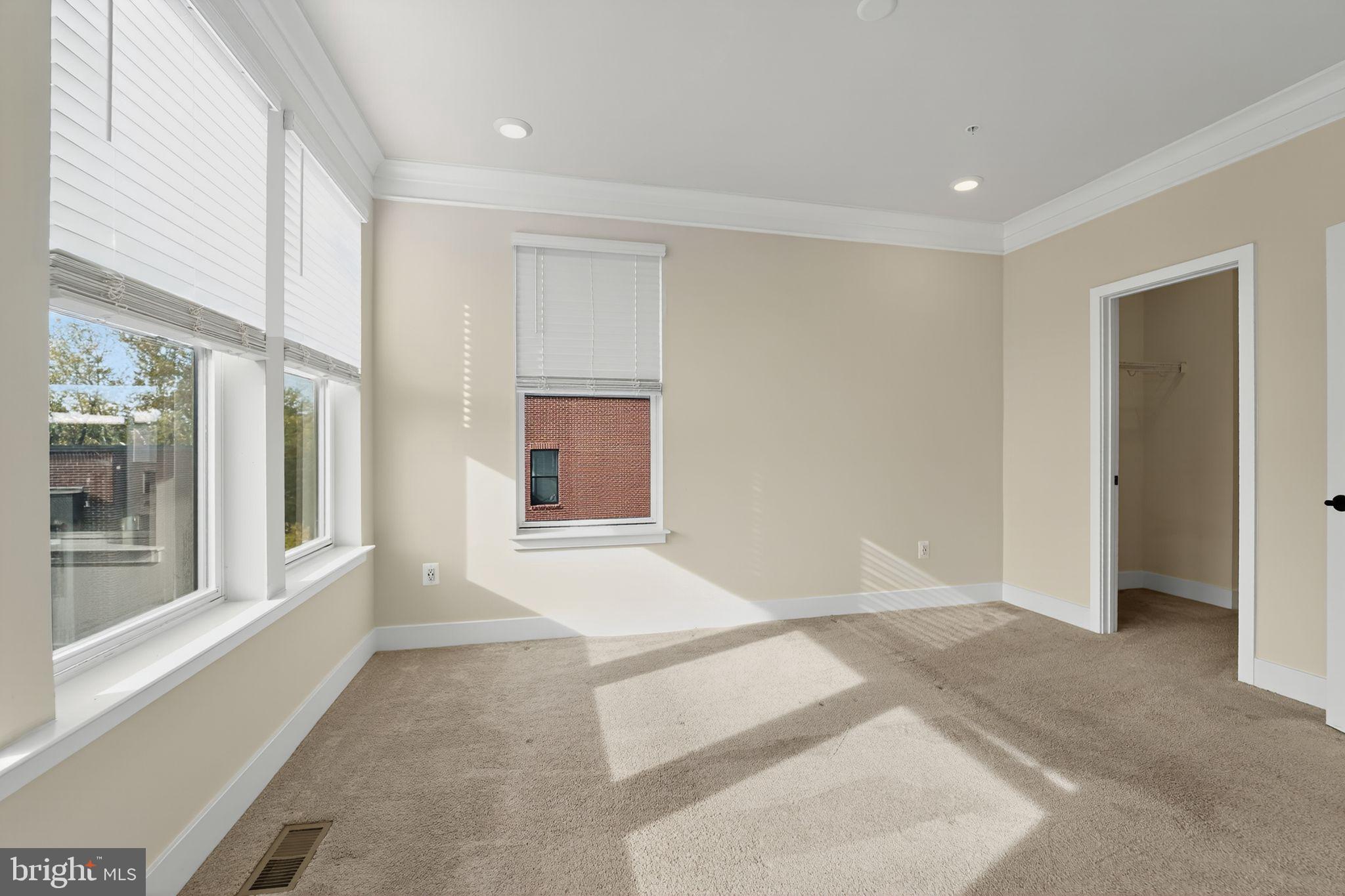 1511 Roland Heights Avenue Baltimore, MD 21211 - Photo 17 of 42 a view of an empty room with a window