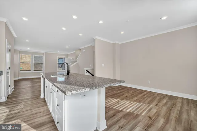 a kitchen with sink and cabinets
