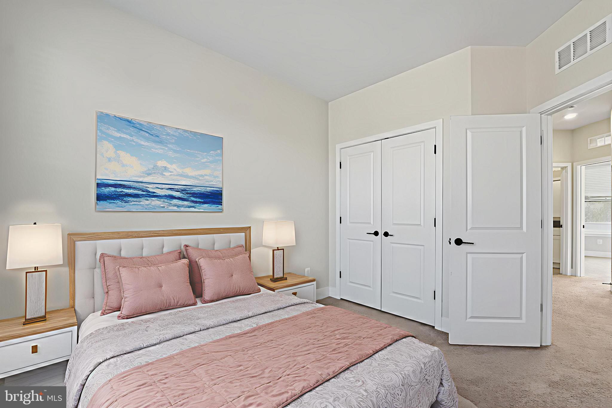 1511 Roland Heights Avenue Baltimore, MD 21211 - Photo 28 of 42 a bedroom with a bed and a painting on the wall