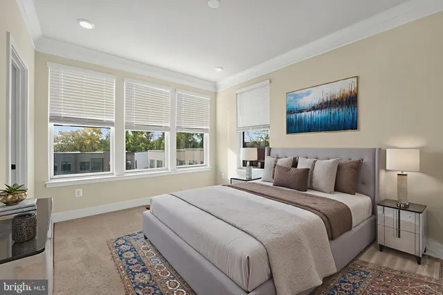 a bedroom with a bed and a couch