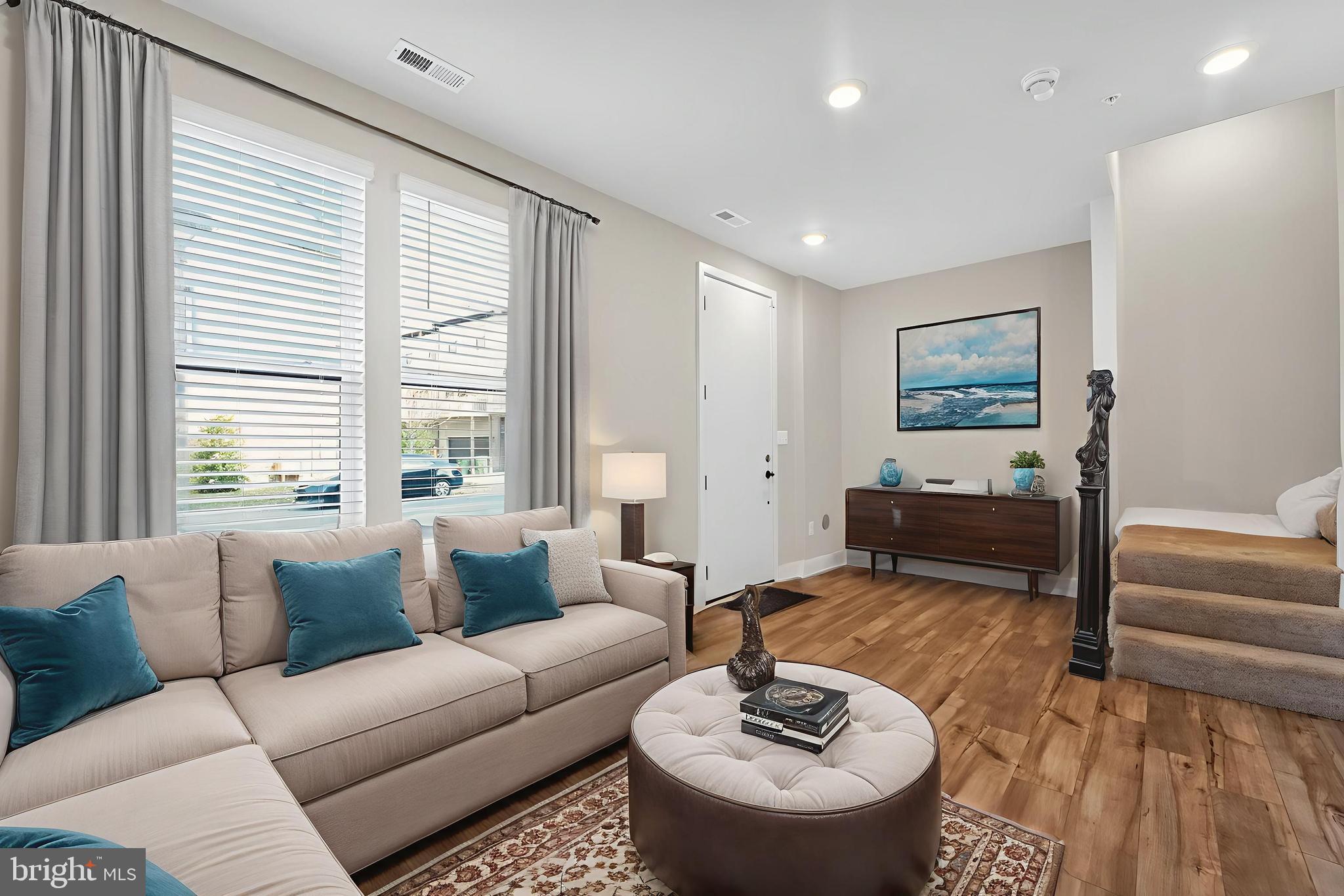 1511 Roland Heights Avenue Baltimore, MD 21211 - Photo 3 of 42 a living room with furniture and a large window