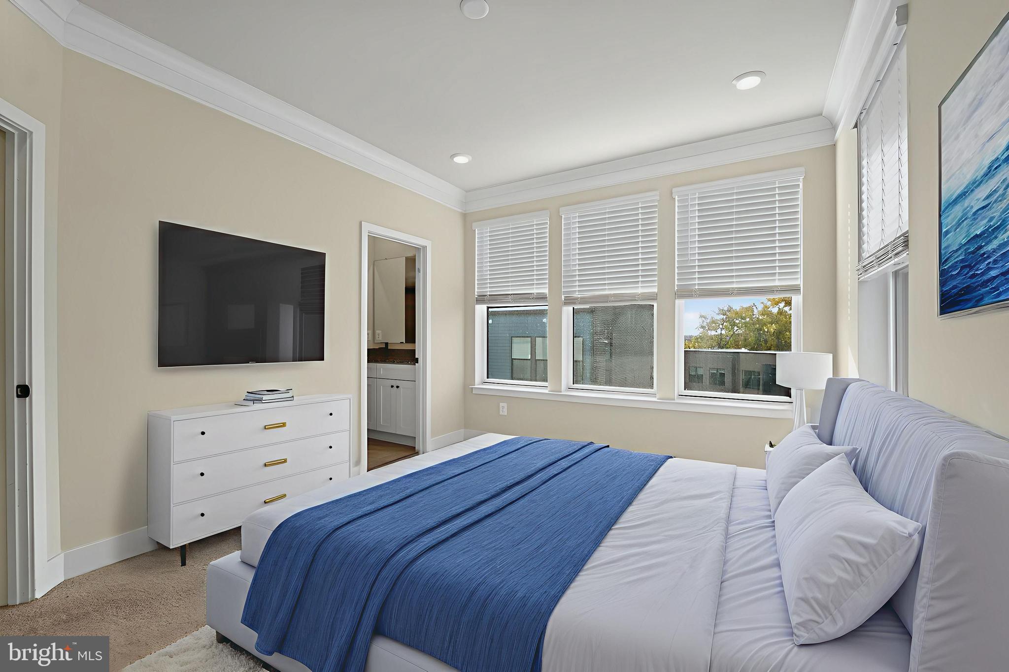 1511 Roland Heights Avenue Baltimore, MD 21211 - Photo 31 of 42 a bedroom with a bed and a flat screen tv