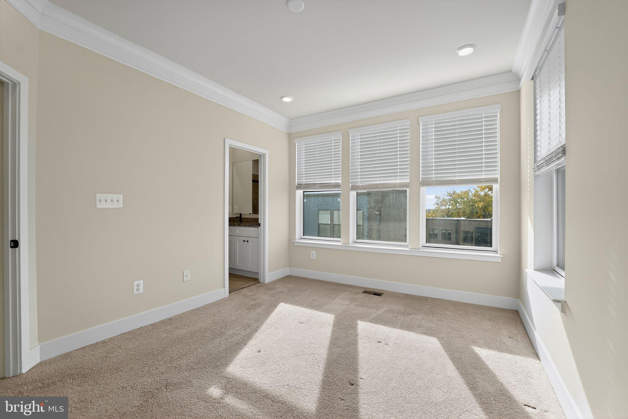 1511 Roland Heights Avenue Baltimore, MD 21211 - Photo 32 of 42 an empty room with windows